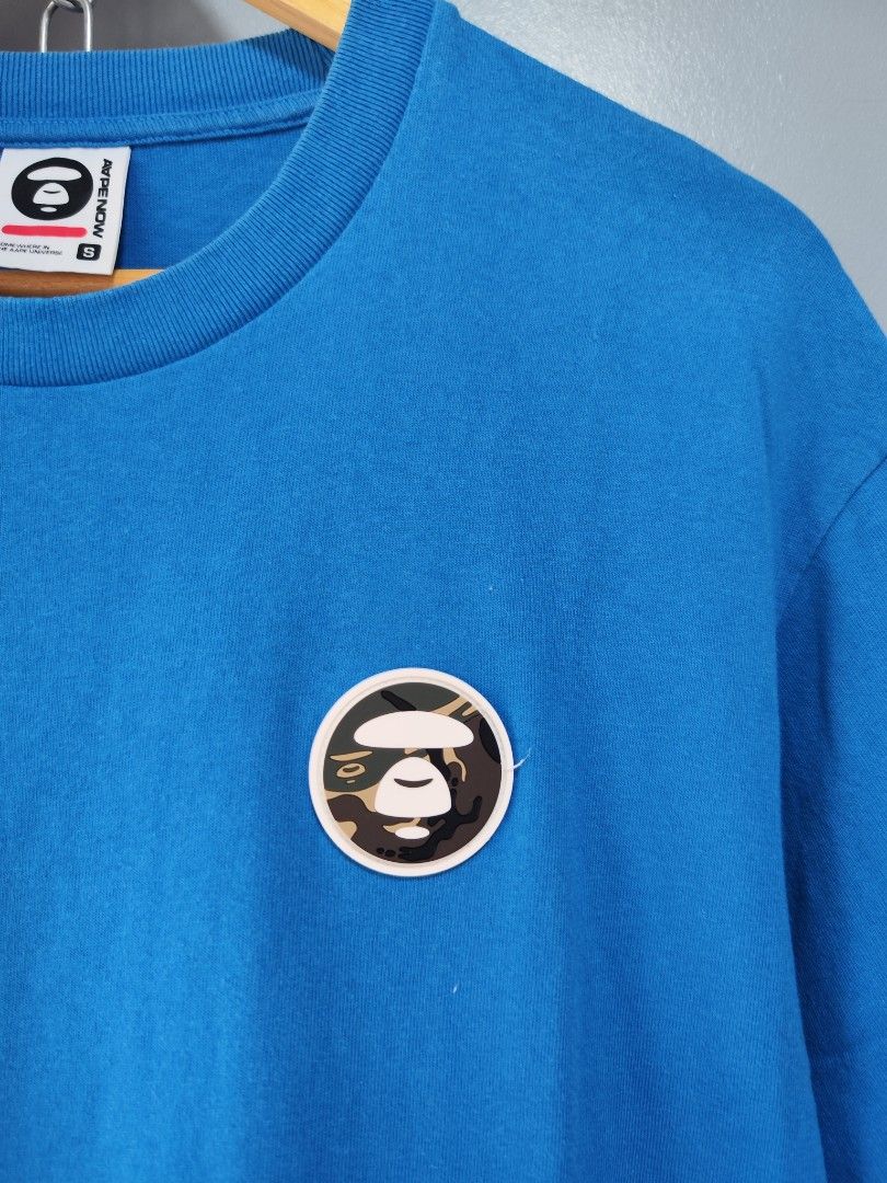 Aape Now Patch Logo Blue Tee (Category: Tshirts & Polo Shirts ) located in Bulacan. Submitted by emilj23 (Listing ID 1459595273, Image 2). Description: Aape Now Patch Logo Blue Tee Size S on tag L 27 W 21 Condition 9/10 Color rate 9/10 Issue Stain.