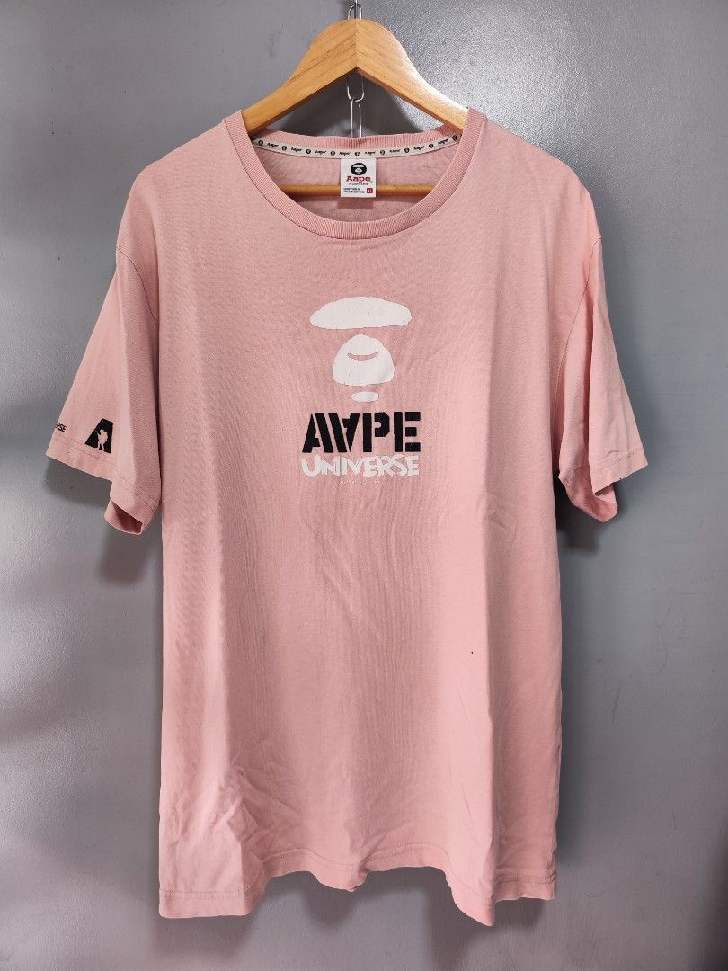 Aape Universe Pink Tee (Category: Tshirts & Polo Shirts ) located in Bulacan. Submitted by emilj23 (Listing ID 1459595120, Image 1). Description: Aape Universe Pink Tee Size XL on tag L 30 W 23 Condition 9/10 Color rate 9/10 Issue Crackprints,Stains,Pinhole.