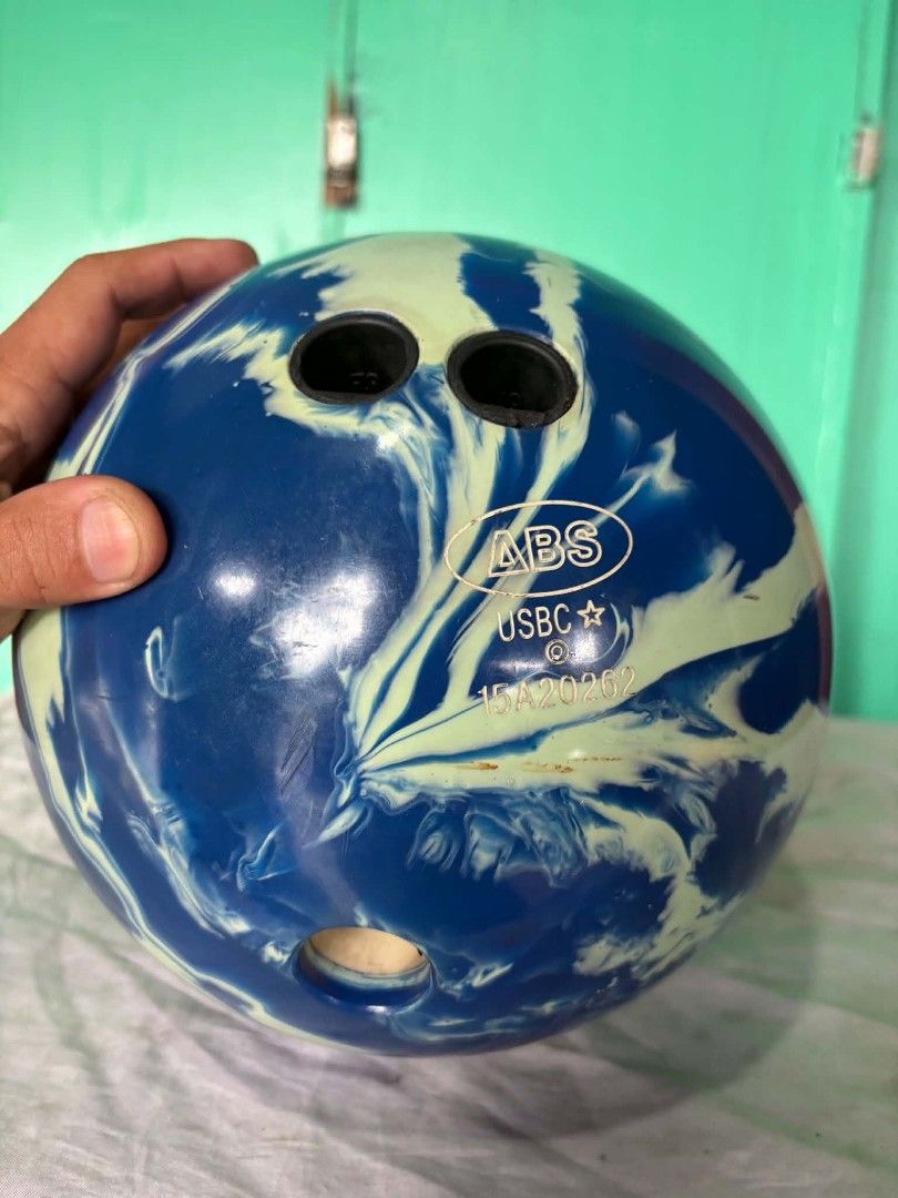 ABS USBC Bowling Ball (Category: Billiards and Bowling) located in Quezon City. Submitted by jpnvintageonline (Listing ID 1459546918, Image 1). Description: - Eye-catching blue and light green swirl design - Features official ABS and USBC markings - Includes standard finger and thumb holes - Ready to hit the bowling alley and improve your game! -12lbs to 13lbs estimated weight .