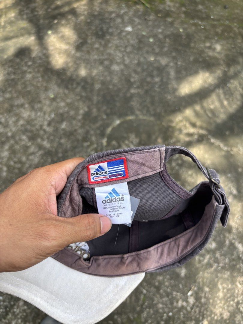 Adidas Cap Authentic One Size Fits All (Category: Caps & Hats) located in Caloocan City. Submitted by elpotato (Listing ID 1459630378, Image 2). Description: - Authentic Grey & White Adidas Cap - One Size Fits All - Adjustable Strap at the Back - Shows some signs of wear (brim & inner band) - Plenty of life left for casual wear.