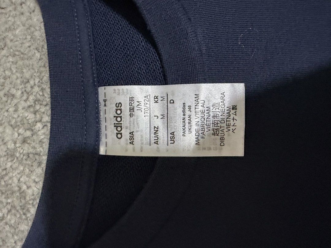 Adidas Navy Blue Sweatshirt with White Stripes (Category: Longsleeves) located in Paranaque City. Submitted by jaietyrone04915 (Listing ID 1459644863, Image 3). Description: - Classic navy blue Adidas sweatshirt - Iconic white stripes on sleeves - Comfortable and casual design - Ideal for everyday wear - Size: Medium (M).
