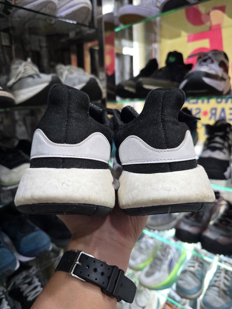 Adidas PureBoost 22 heat.rdy (Category: Sneakers) located in Iba. Submitted by conditionexcellente (Listing ID 1459552178, Image 3). Description: - Adidas Ultraboost running shoes - Color: Black with white accents and sole - Size: US 7 / UK 6.5 / FR 40 / JP 250 - Manufactured: January 2023 (Made in China) - Key Feature: Boost technology in sole for superior comfort and energy return - Ideal for: Running, training, or everyday casual wear.