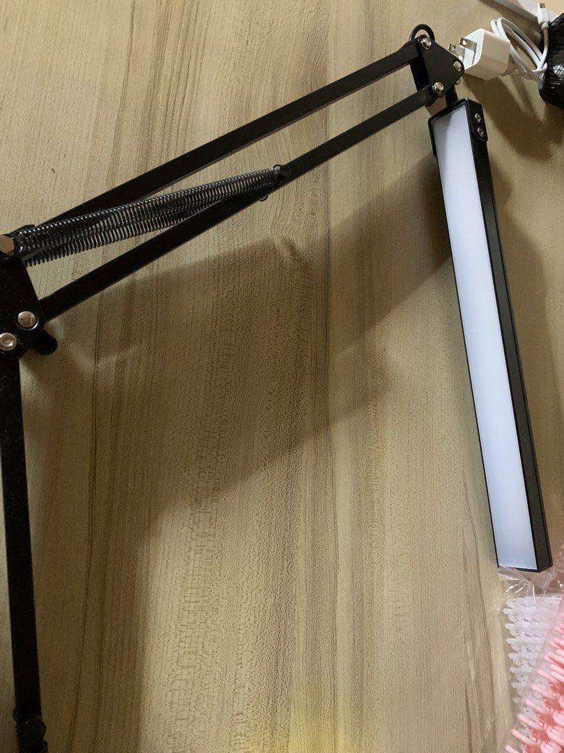 Adjustable LED Desk Lamp with Clamp (Category: Lighting) located in Tarlac. Submitted by haku8482 (Listing ID 1459598944, Image 2). Description: rfs: bought a new one - Adjustable LED desk lamp (no issue) - Sleek black metal arm with spring support - Secure clamp for desks or tables - Convenient USB powered operation - Bright illumination, perfect for studying or working - Amazing sale price: ₱334 (Original Price: ₱1,665).