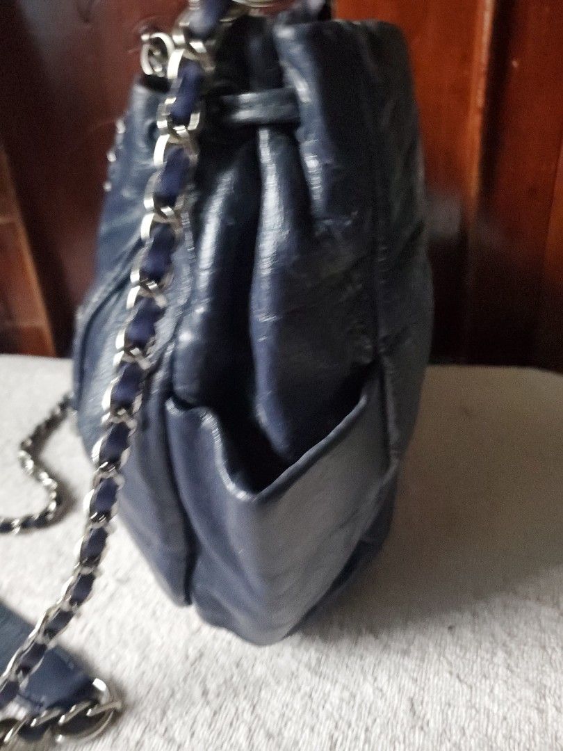 AGNES B. LEATHER DRAWSTRING CHAIN BAG (Category: Luxury Bags & Wallets) located in Manila. Submitted by smicolen (Listing ID 1459626201, Image 3). Description: - leather drawstring bag by Agnès b. - chain strap and hardware. - Spacious main compartment. - Interior zip pocket for secure storage. - Ideal for everyday wear. - Dimensions: 9.5" Length x 11.25" Width. - Bottom width: 3.5" issue - repaint ,signs of usage .