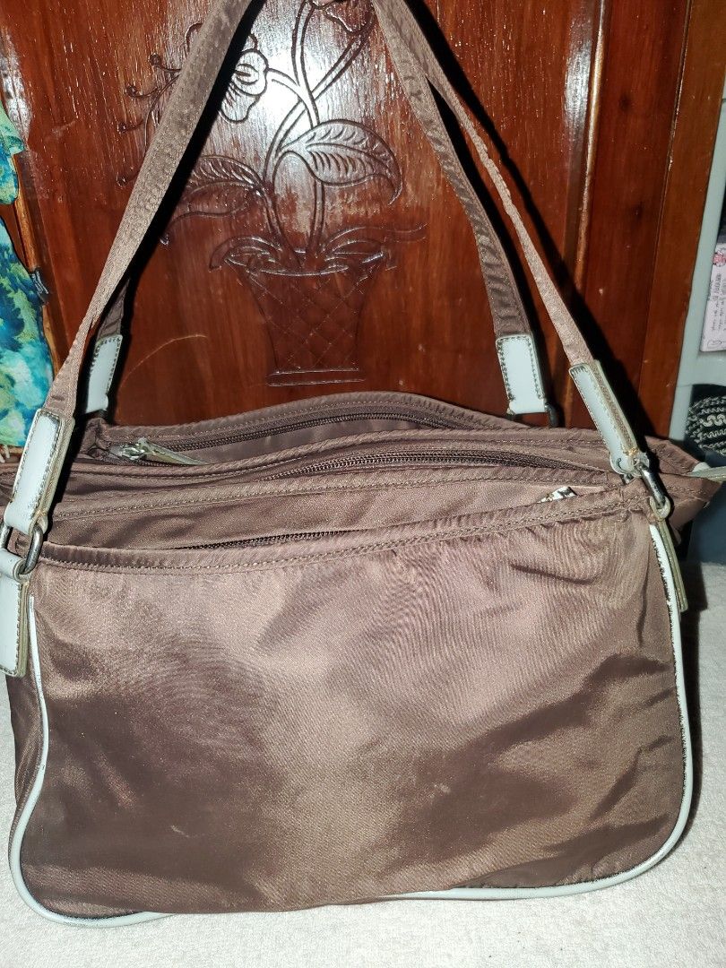 AGNÈS B. VOYAGE BROWN NYLON SHOULDER BAG (Category: Luxury Bags & Wallets) located in Manila. Submitted by smicolen (Listing ID 1459627493, Image 2). Description: - Brand: Agnès b. Voyage - Material: Brown Nylon - Style: Shoulder Bag - Features: Multiple zippered compartments for excellent organization - Straps: Comfortable for everyday wear - Dimensions: Length 8", Width 10 1/2", Bottom 4 1/2" - Ideal for: A great everyday bag ISSUES: signs of u