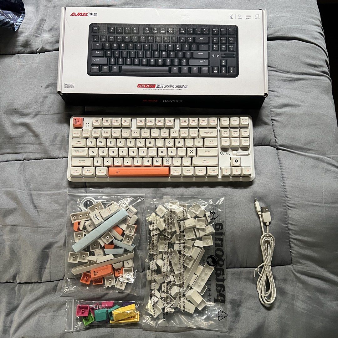 Ajazz 870T (Category: Computer Keyboard) located in Quezon City. Submitted by kindleton (Listing ID 1459552215, Image 2). Description: Brown switch, not hot-swappable, well-maintained, only used for working (video editing), RGB lights working 100%, can be wired or bluetooth - all still working well. no issues. Comes with: - Original box - Original type c cable - Original white key caps - Off-White Themed key caps worth ₱700 RFS: not using anymore