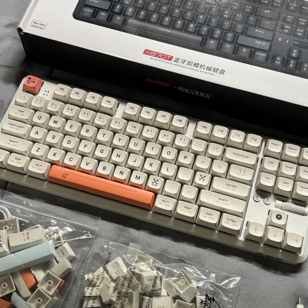 Ajazz 870T (Category: Computer Keyboard) located in Quezon City. Submitted by kindleton (Listing ID 1459552215, Image 1). Description: Brown switch, not hot-swappable, well-maintained, only used for working (video editing), RGB lights working 100%, can be wired or bluetooth - all still working well. no issues. Comes with: - Original box - Original type c cable - Original white key caps - Off-White Themed key caps worth ₱700 RFS: not using anymore