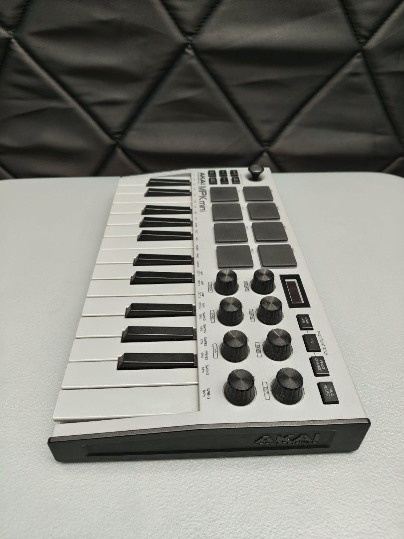 AKAI MPK Mini Professional MIDI Keyboard Controller (Category: Musical Instruments) located in Manila. Submitted by jimbo2003 (Listing ID 1459584798, Image 2). Description: - AKAI MPK Mini Professional MIDI Keyboard Controller - 25 velocity-sensitive keys - 8 MPC-style backlit drum pads - 8 assignable knobs for controlling parameters - 4 programmable memory banks - Perfect for music production and beatmaking - In excellent working condition.