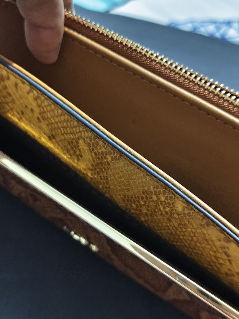 ALDO OCOISSA Wallet - Brown & Yellow Snake Print (Category: Wallets & Card holders) located in Manila. Submitted by jencis_01 (Listing ID 1459569332, Image 2). Description: -New!!! - Stylish ALDO wallet - Eye-catching snake print in brown and yellow tones - Secure zipper closure - Brand new with original tag attached - Ideal for organizing your cards, cash, and other essentials *Padala saken from Abroad pero di po ako mahilig sa ganyang wallet😅 