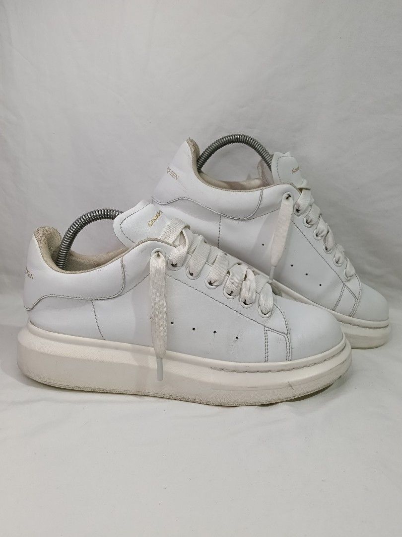Alexander McQueen Oversized Sneakers White Leather FREE SHIP (Category: Sneakers) located in San Pedro. Submitted by jacb19 (Listing ID 1459528306, Image 1). Description: - Classic white leather Alexander McQueen oversized sneakers - Signature chunky sole size 42 - Gold Alexander McQueen branding on tongue and heel - White laces - Soles show some wear from use - Perfect statement shoes for any outfit Payment: PAYMENT FIRST Gotyme Shipping thru J&