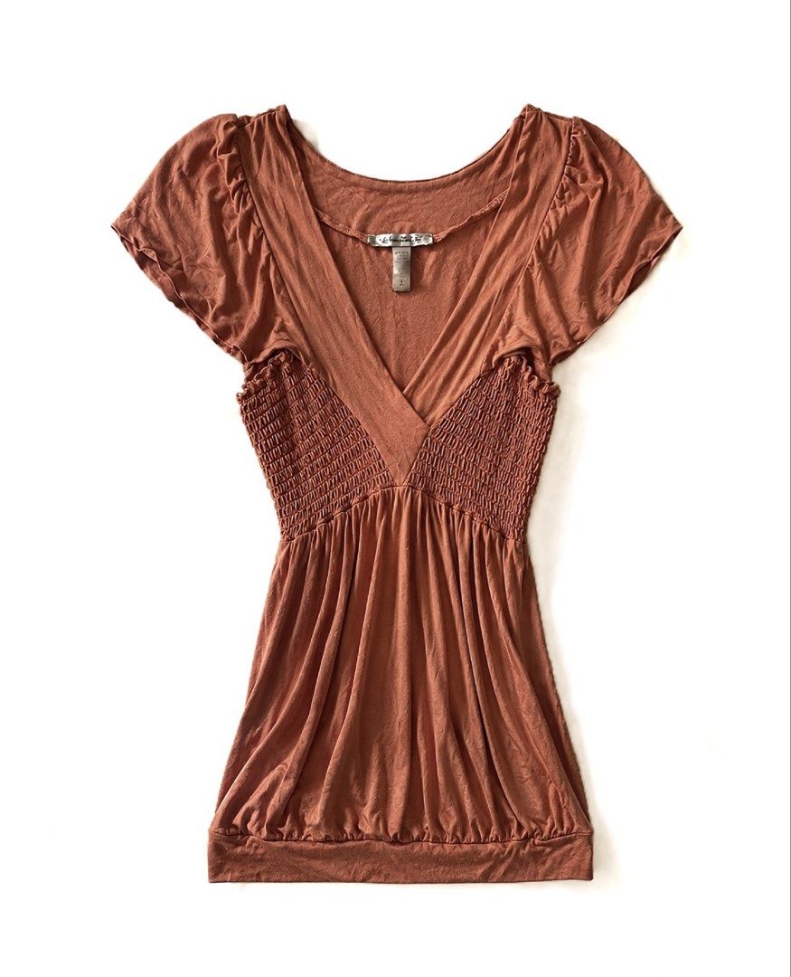 American Rag Smocked V-Neck Top (Category: Sleeveless) located in Batac City. Submitted by doniagel (Listing ID 1459500881, Image 1). Description: - Cute top from American Rag - Smocked bodice with V-neckline - Cap sleeves with slight ruffle - Soft fabric blend - Versatile for casual or dressy occasions - Easy to pair with jeans or skirts - size s-m - stretchable.