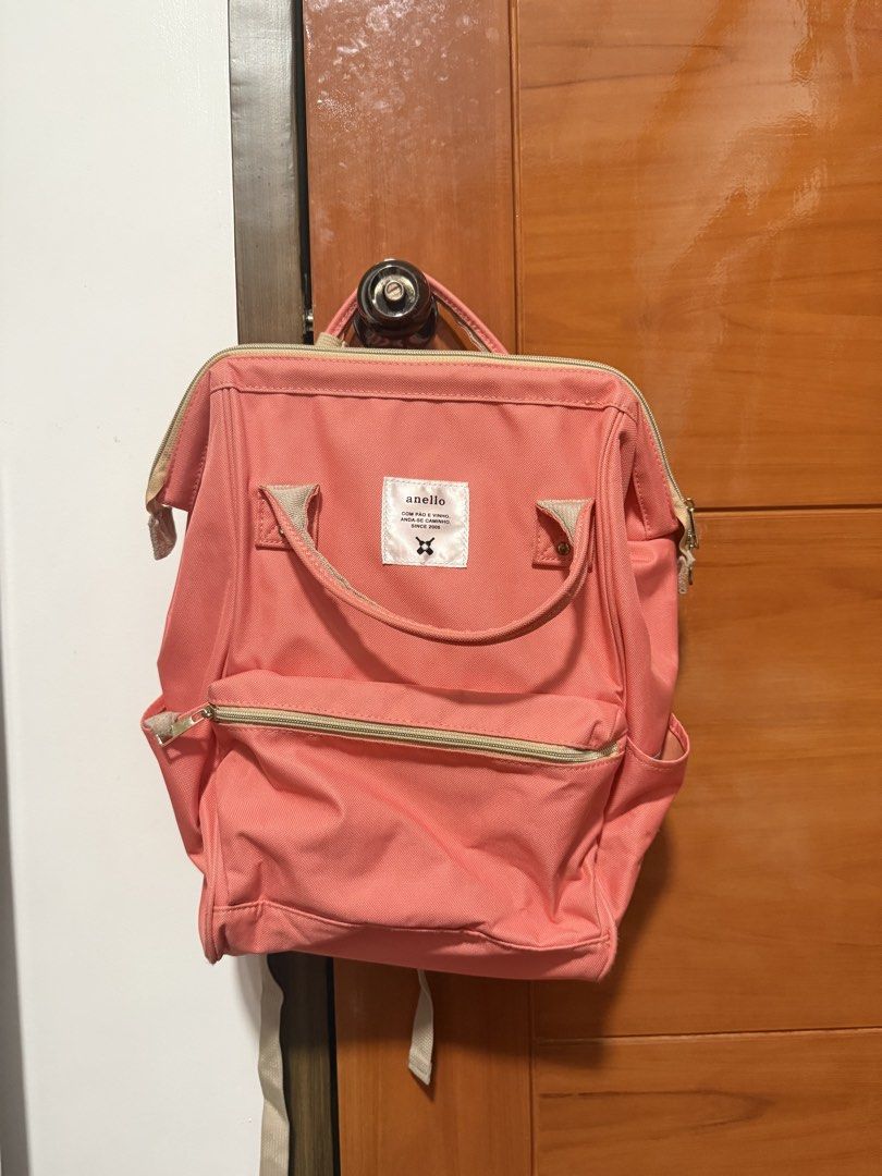 Anello Backpack Coral Pink (large) (Category: Backpacks) located in Balanga. Submitted by liiiizzzzzzzzz (Listing ID 1459536783, Image 1). Description: - coral pink Anello backpack - Main zip compartment - Front zip pocket - Side pockets - Adjustable straps - Minor marks on fabric (please check photos) - RFS: decluttering .
