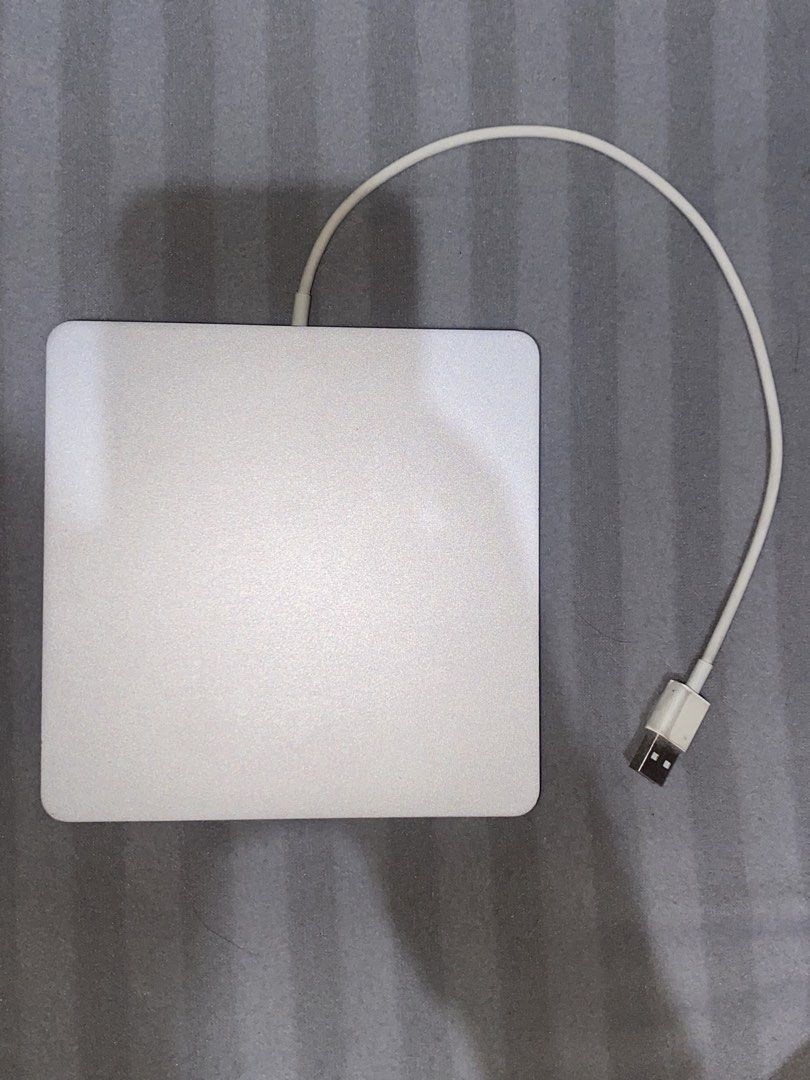 Apple SuperDrive DVD (Category: Other Accessories) located in Binangonan. Submitted by r0nb1nt5cat5co (Listing ID 1459671544, Image 1). Description: Compatible with Windows and MacOS. Minor dings along the edge of the unibody of dvd. Will provide a driver for Windows Compatibility since Windows not ready for plug and play..