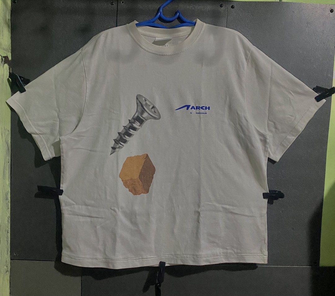 ARCH Graphic Boxy shirt (Category: Tshirts & Polo Shirts ) located in Iba. Submitted by gotmethrift (Listing ID 1459627749, Image 1). Description: Heavy cloth Width: 23 Length: 27 Issue: minimal stain (not sure kung washable).