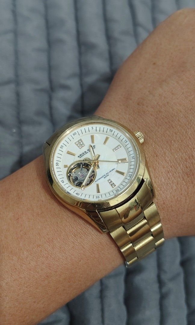 Aries Gold Inspira (Category: Men's Watches) located in Cebu City. Submitted by aceoftime (Listing ID 1459658270, Image 2). Description: In excellent condition 24 Jewels Automatic NH38A movt open heart mother of pearl dial All stainless steel in yellow gold plating Sapphire Crystal ( Scratch resistant) Timegraph registers +-2 per sec deviation Healthy movt Watch only Our Guarantee: 💯 Authentic All watches are checked by our experienced technicia