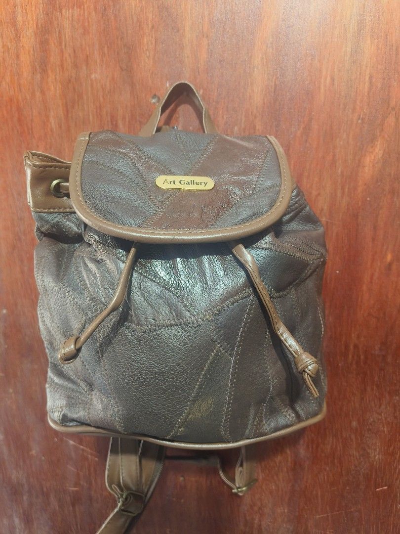 Art Gallery Patchwork Leather Drawstrings (Category: Backpacks) located in San Jose del Monte. Submitted by m_nshop (Listing ID 1459556044, Image 1). Description: - Cute brown leather backpack from Art Gallery - Unique patchwork design all over - Secure drawstring closure with a flap top - Adjustable straps for comfort - Lined interior - Perfect for everyday use or travel with sign of usage and storage from Japan Auction payment first jnt or lala