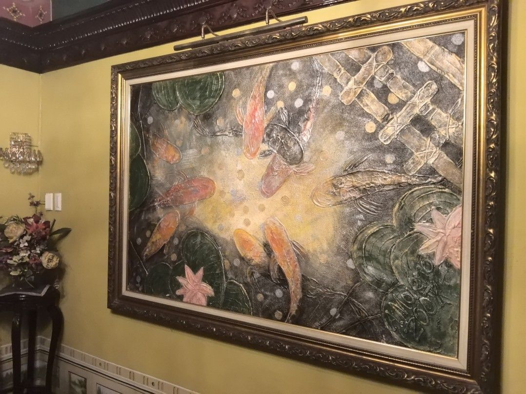 Arts by Angel Moreno (Category: Wall Decor) located in Manila. Submitted by snooks1938 (Listing ID 1459496948, Image 2). Description: Up for Sale.. Koi Fish by ANGEL MORENO YEAR 2007 SIZE 45 X 75 - Large framed painting of koi fish in a pond - Features lily pads and a textured finish - Ornate, gold-colored frame - Signed 'MOON OO DA' (bottom right) - Makes a stunning statement piece for any wall.