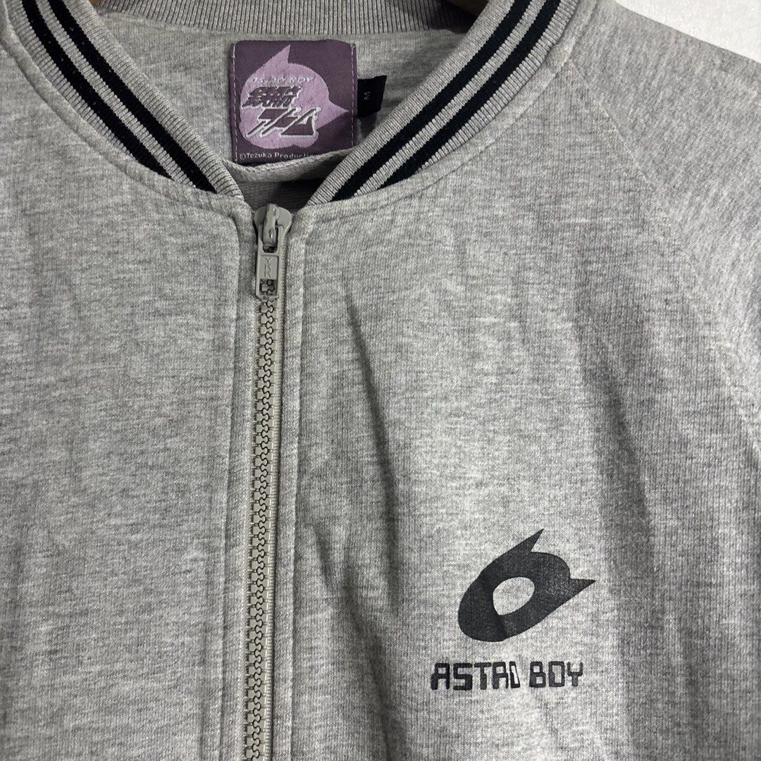 Astro Boy - Grey Bomber Jacket Tezuka Productions (Category: Coats, Jackets and Outerwear) located in Cavite. Submitted by goodstayojan.cvt (Listing ID 1459606111, Image 3). Description: Astroboy - Zipped Jacket M on tag(17.5 x 22.5) Verygood Condition No flaws! - Grey Astro Boy bomber jacket - Features iconic Astro Boy logo on the chest - Ribbed collar, cuffs, and hem with stylish black stripes - Convenient zipper closure - Officially licensed b