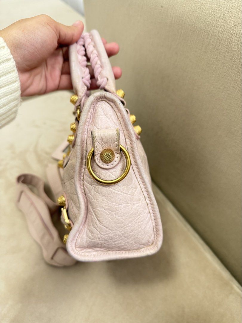Authentic Balenciaga Mini City Big Giant Stud (Category: Luxury Bags & Wallets) located in Manila. Submitted by maria_2326 (Listing ID 1459602119, Image 3). Description: Balenciaga Mini City Big Giant Stud Baby Pink | Guarantee Authentic With strap only Flaw: Please see details photos, dirt on body, handle wears, corner wears/rubs. Needs bag spa No lowballing! Location: Manila/QC.