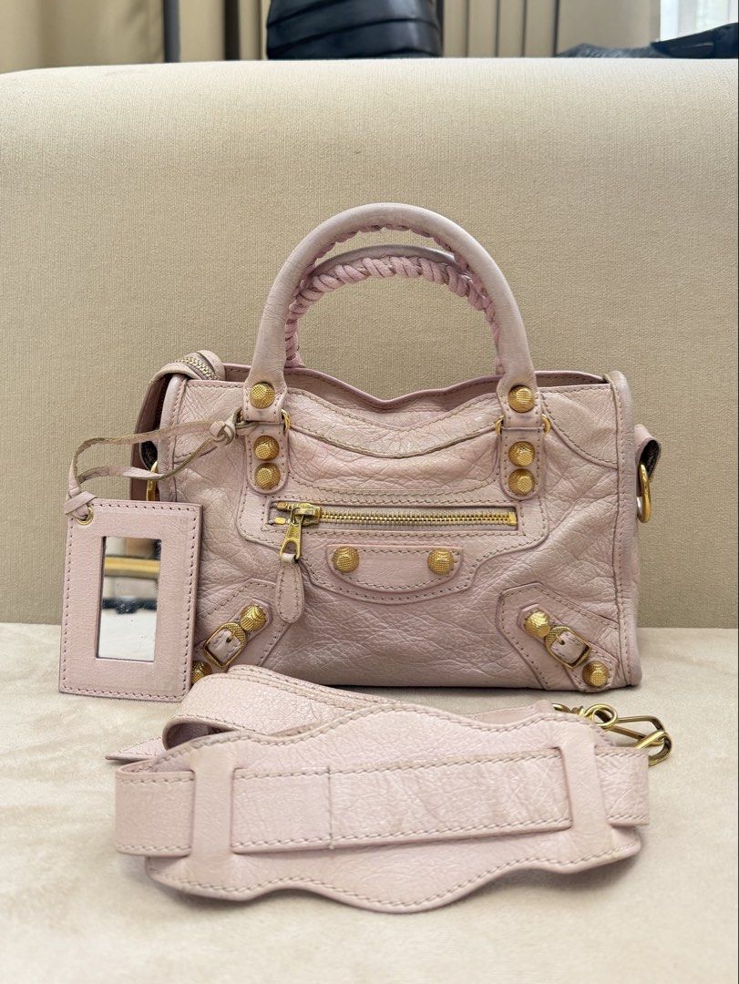 Authentic Balenciaga Mini City Big Giant Stud (Category: Luxury Bags & Wallets) located in Manila. Submitted by maria_2326 (Listing ID 1459602119, Image 1). Description: Balenciaga Mini City Big Giant Stud Baby Pink | Guarantee Authentic With strap only Flaw: Please see details photos, dirt on body, handle wears, corner wears/rubs. Needs bag spa No lowballing! Location: Manila/QC.