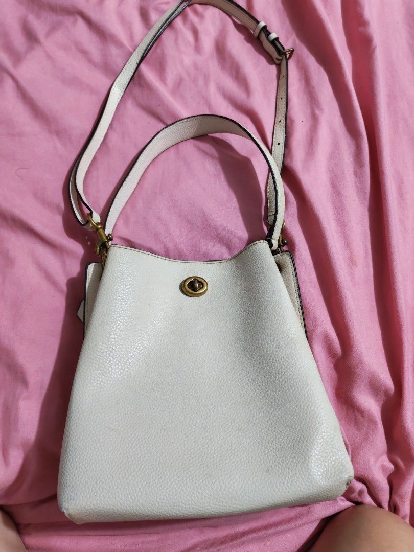 Authentic Coach (Category: Shoulder Bags) located in Quezon City. Submitted by preetycindz (Listing ID 1459639779, Image 1). Description: - Stylish white bucket bag - Pebbled texture material - Secure turn-lock closure - Adjustable shoulder strap - Spacious enough for daily essentials - Clean and well-maintained interior 100% Original coach.