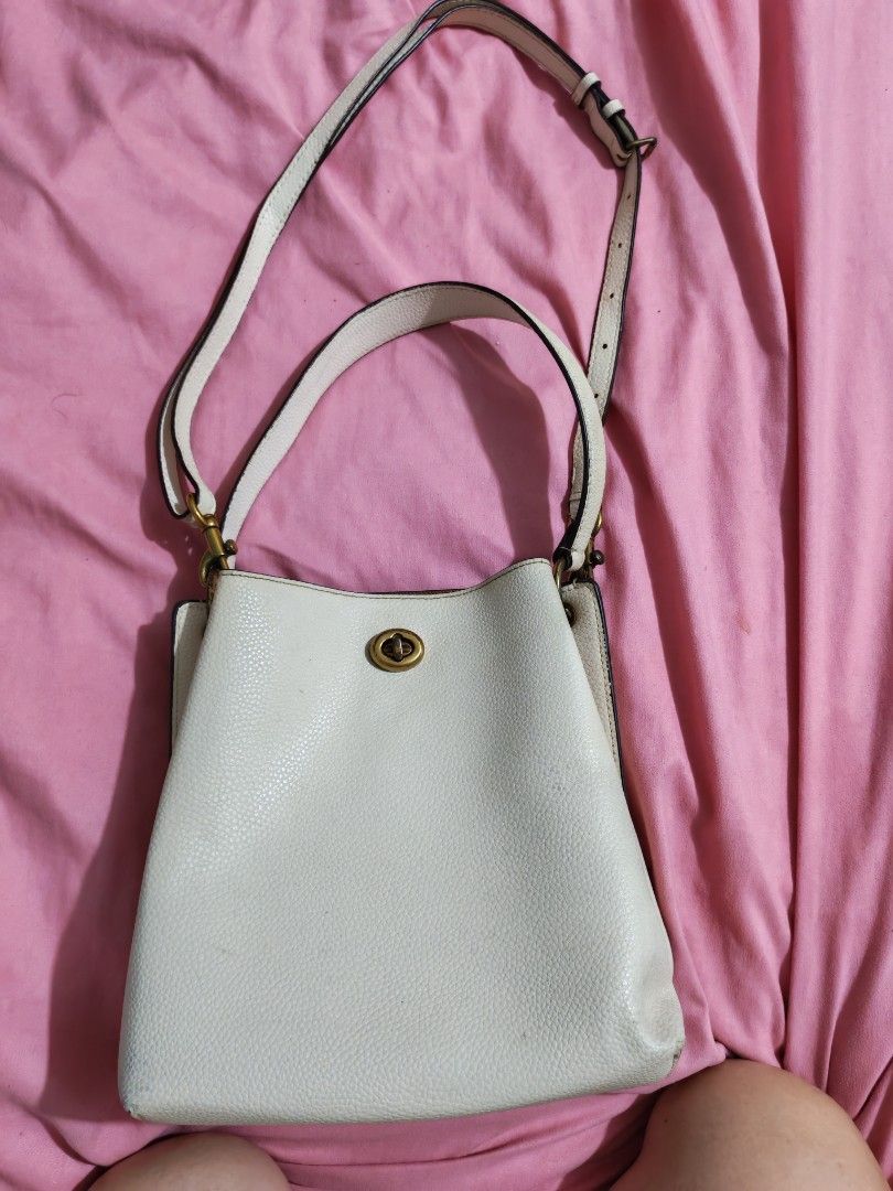 Authentic Coach (Category: Shoulder Bags) located in Quezon City. Submitted by preetycindz (Listing ID 1459639779, Image 2). Description: - Stylish white bucket bag - Pebbled texture material - Secure turn-lock closure - Adjustable shoulder strap - Spacious enough for daily essentials - Clean and well-maintained interior 100% Original coach.