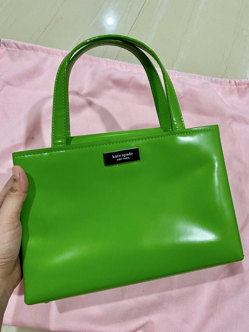 AUTHENTIC Kate Spade Sam Icon/ Leather/ Green (Category: Luxury Bags & Wallets) located in Cabanatuan. Submitted by littleluna02 (Listing ID 1459609604, Image 1). Description: - Super cute Kate Spade top handle bag - Vibrant green color - Small and compact, ideal for essentials - Classic shape with a modern feel - Adds a pop of color to any outfit - Brand name clearly visible on the front.