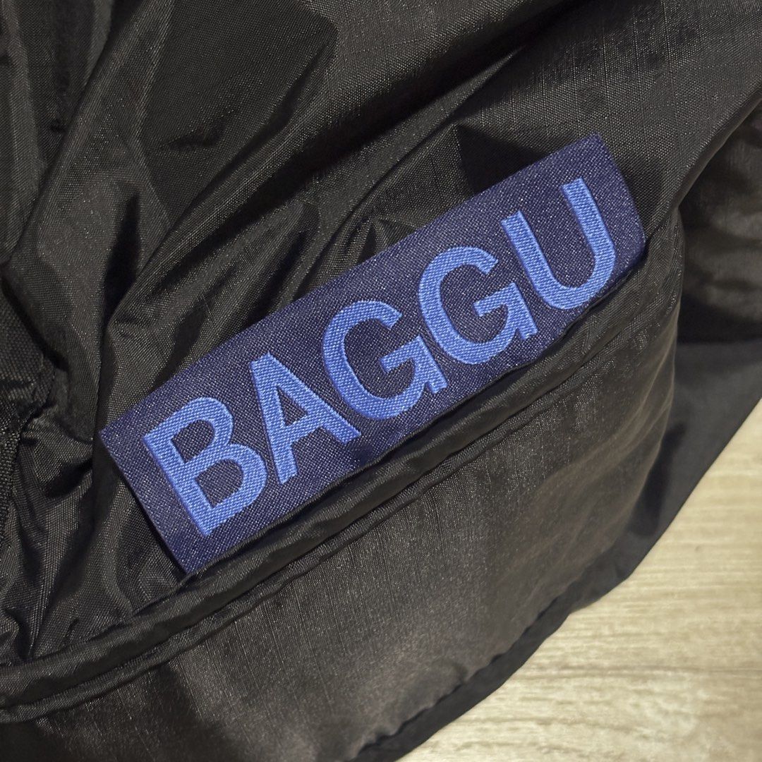 BAGGU Nylon Shoulder Bag in Black (Category: Shoulder Bags) located in Marikina City. Submitted by frankiecleanup (Listing ID 1459627613, Image 3). Description: - Brand: BAGGU - Material: Black Nylon - Closure: Zipper - Strap: Adjustable with ribbed texture - Features: Spacious interior, ideal for everyday use - Interior: Intact label and zippered pocket - Reason for selling: Got a new work bag.
