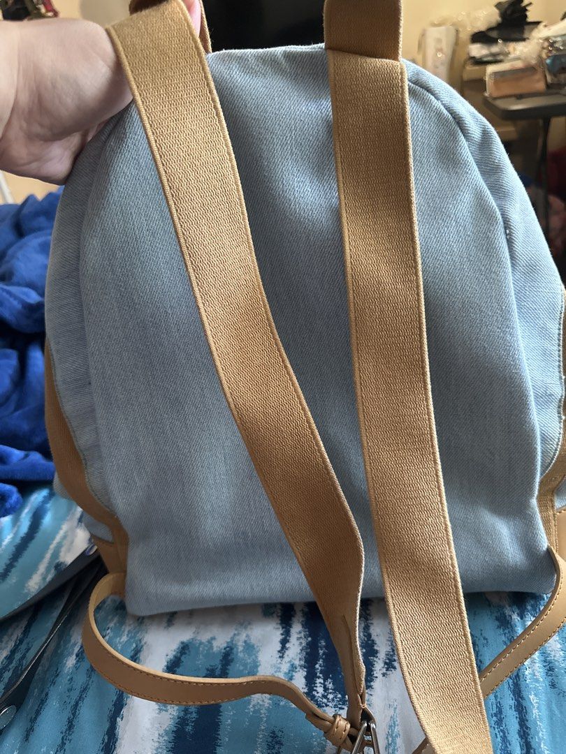 Balenciaga Paris Denim Backpack with Leather Trim (Category: Luxury Bags & Wallets) located in Antipolo. Submitted by prelovedcloseta (Listing ID 1459525666, Image 3). Description: -authentic - Balenciaga Paris backpack - Light wash denim with tan leather accents - Adjustable shoulder straps - Front zipper pocket - Main zipper compartment - Features Balenciaga Paris logo on the front pocket - Perfect for everyday use -preloved but in good conditi