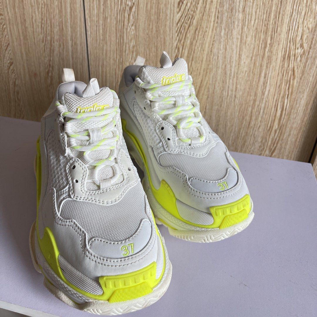 Balenciaga Triple S Sneakers (Category: Sneakers) located in Cebu City. Submitted by lequiaabanid (Listing ID 1459642473, Image 2). Description: BALENCIAGA TRIPLE S – WHITE/NEON YELLOW Preloved Balenciaga Triple S 💚 ✨ Good condition & well maintained ✨ Lightly used and still in great shape ✨ Minor stain/signs of usage on the side (please see photos) ✨ Perfect for casual, streetwear and everyday outfits 📸 More pictures are available upon request