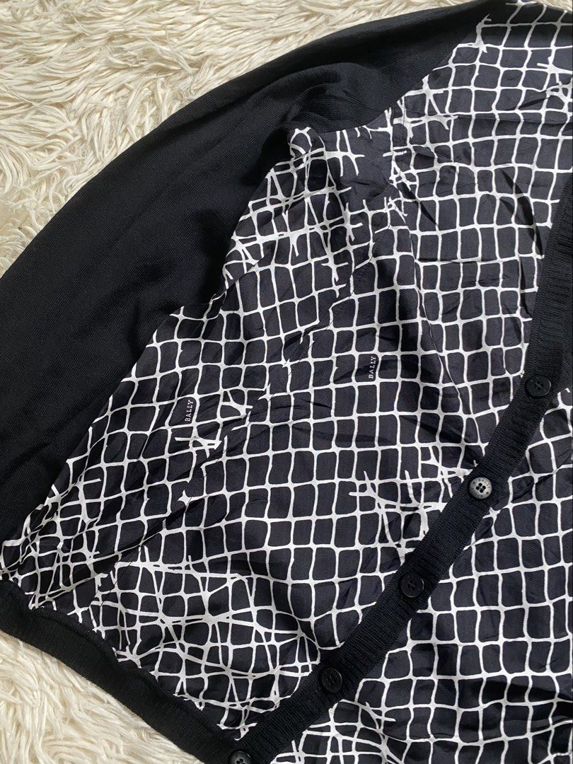 Bally Black & White Patterned Cardigan (Category: Luxury Apparel) located in Antipolo. Submitted by switchneighborhood (Listing ID 1459530601, Image 2). Description: - Bally Cardigan - Black with striking geometric pattern on front - Plain black sleeves and back - Made from 100% Extrafine Merino Wool and 100% Silk - Button front closure - Ideal for layering - Check label for size details.
