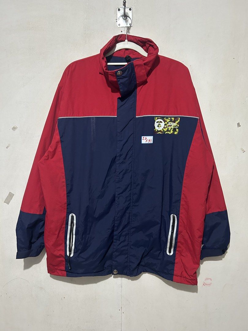 BAPE Color Block Jacket Red Navy (Category: Coats, Jackets and Outerwear) located in Mandaluyong City. Submitted by 0lg2026 (Listing ID 1459687833, Image 2). Description: - Stylish BAPE jacket - Eye-catching red and navy color block design - Classic BAPE camo ape head logo on chest - Two convenient zip pockets - Ideal for everyday casual wear.