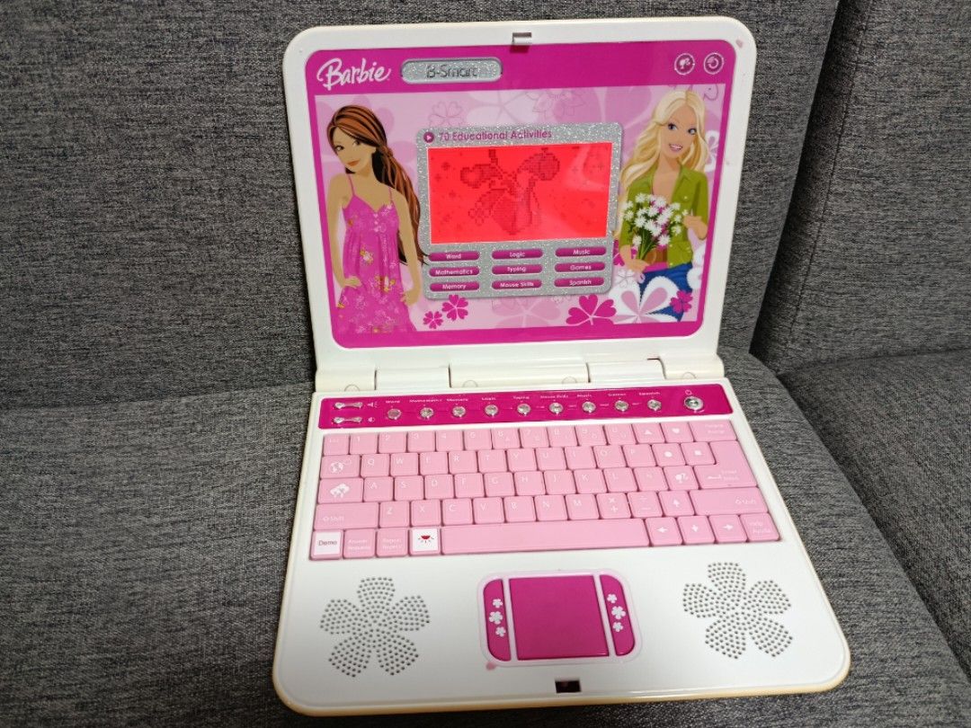 Barbie B-Smart Educational Toy Laptop (Category: Kids Toys) located in Quezon City. Submitted by robelles_thriftshop (Listing ID 1459652918, Image 2). Description: - Barbie B-Smart educational laptop for kids - Features games, typing, math, and Spanish lessons - Fun pink keyboard and touchpad - Great for learning and entertainment - Requires 3x AA batteries (not included) - Item No: E-8098-080.