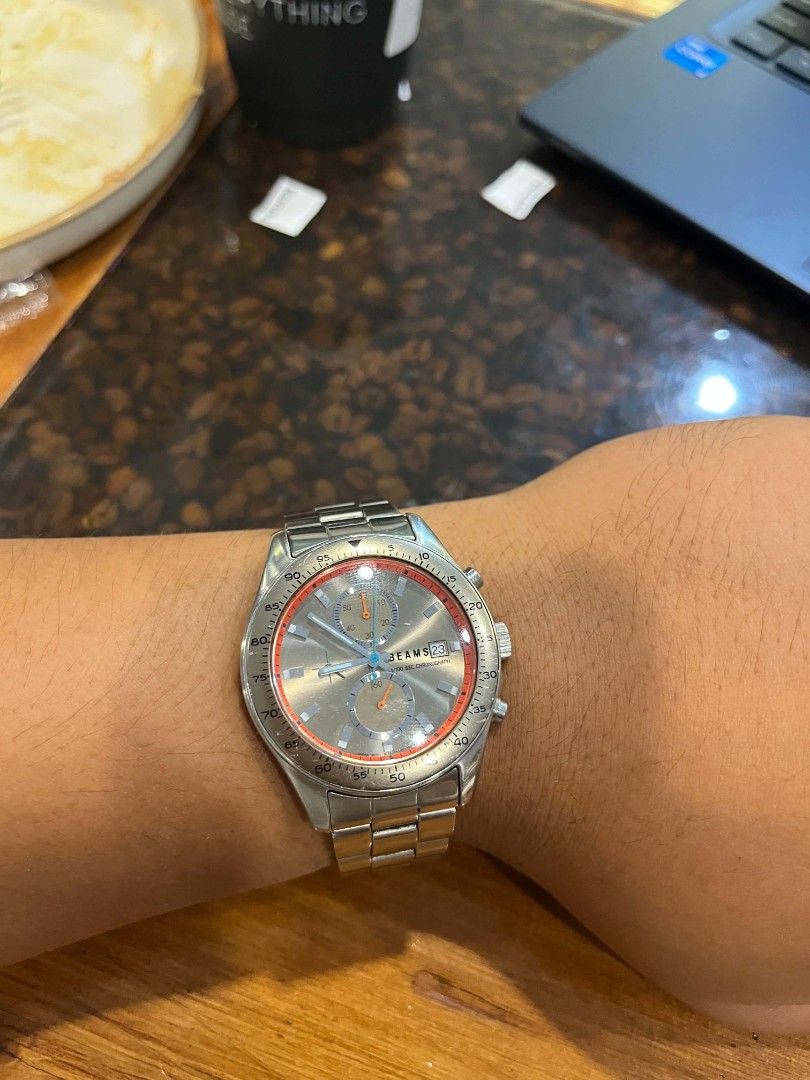 BEAMS Chronograph Watch (Category: Men's Watches) located in Cebu City. Submitted by jbok_watches. (Listing ID 1459634975, Image 3). Description: - Citizen BEAMS silver-tone chronograph watch - Grey dial with orange accents - Three subdials - Stainless steel band - Date window at 3 o'clock - Versatile for everyday or formal wear.