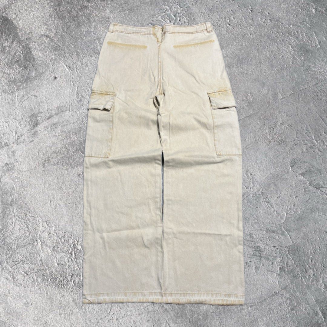 Beige Cargo Pants Wide Leg (Category: Other Bottoms) located in Pasig City. Submitted by thrift2mnl (Listing ID 1459615021, Image 2). Description: Baggy Cargo Pants - Cream Waist: 34 Length: 41 Leg O: 13 Hem: 11.5.