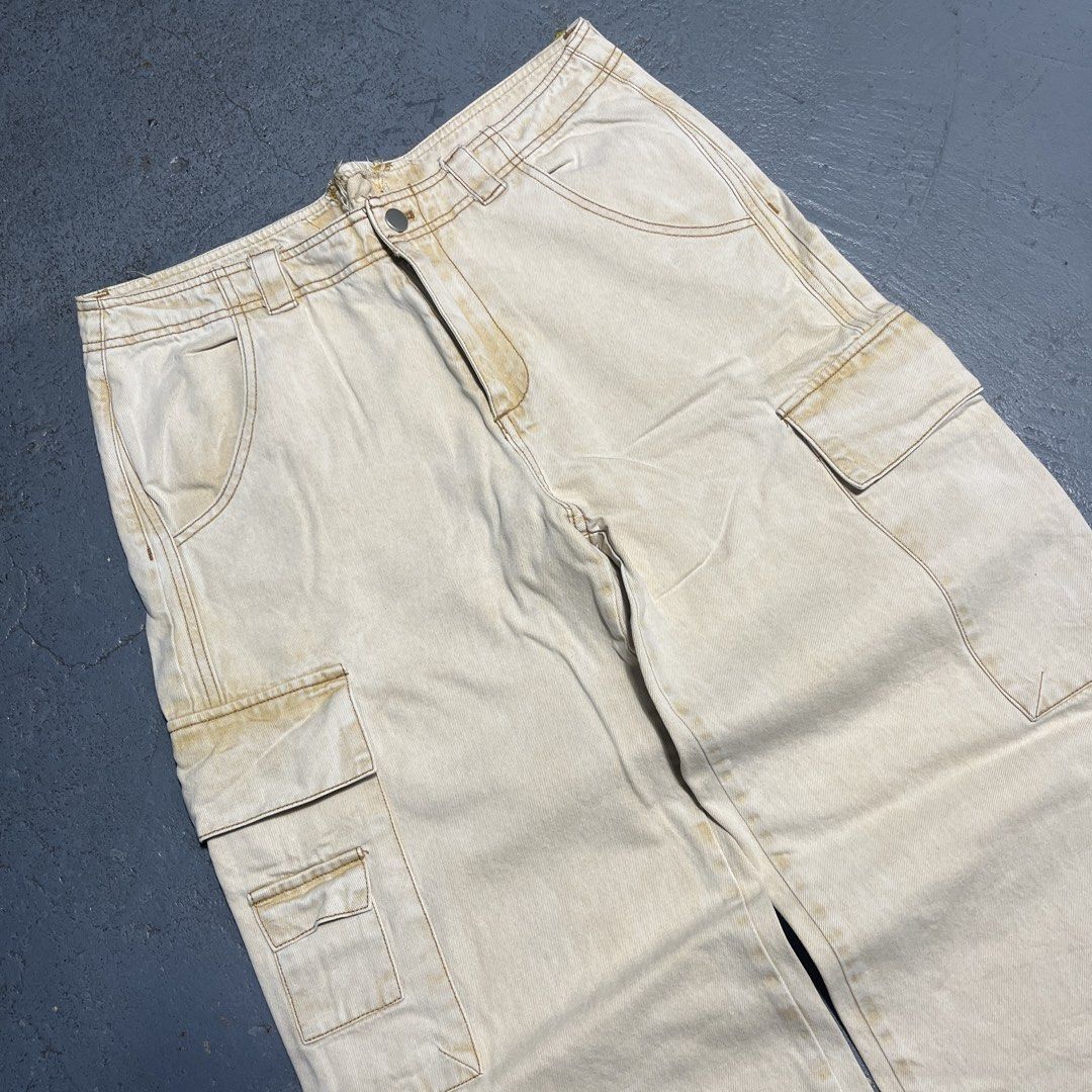 Beige Cargo Pants Wide Leg (Category: Other Bottoms) located in Pasig City. Submitted by thrift2mnl (Listing ID 1459615021, Image 3). Description: Baggy Cargo Pants - Cream Waist: 34 Length: 41 Leg O: 13 Hem: 11.5.