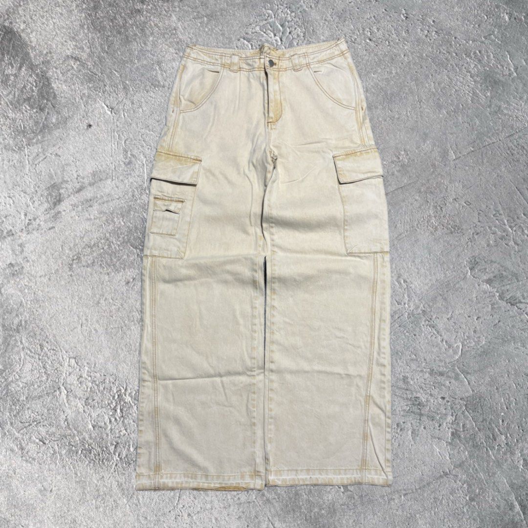 Beige Cargo Pants Wide Leg (Category: Other Bottoms) located in Pasig City. Submitted by thrift2mnl (Listing ID 1459615021, Image 1). Description: Baggy Cargo Pants - Cream Waist: 34 Length: 41 Leg O: 13 Hem: 11.5.
