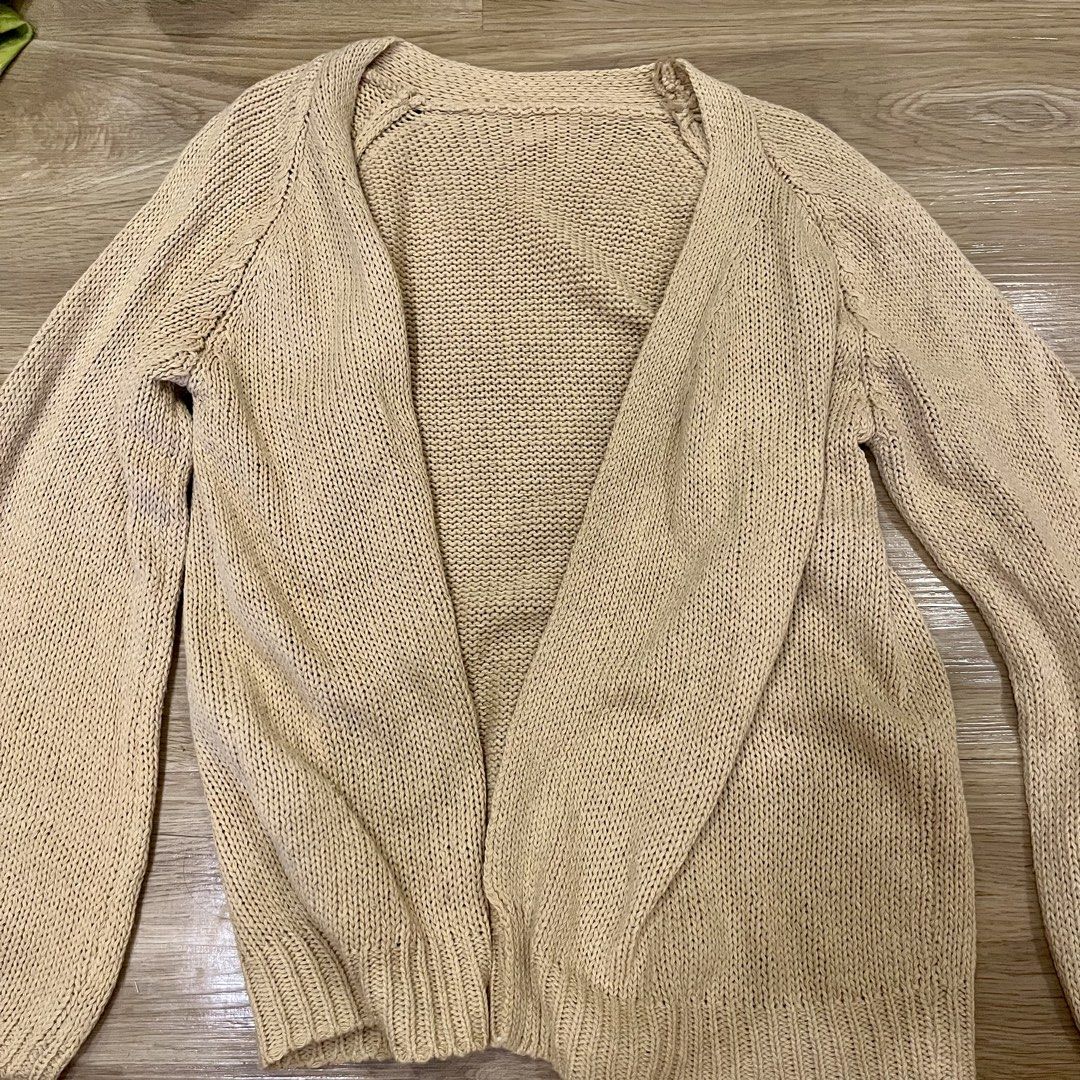 Beige Knit Open Front Cardigan (Category: Coats, Jackets and Outerwear) located in Paranaque City. Submitted by kalattt (Listing ID 1459544699, Image 1). Description: - Lightweight beige knit cardigan - Open front style - Relaxed fit - Long sleeves - Ribbed hem - Versatile layering piece, easy to dress up or down.