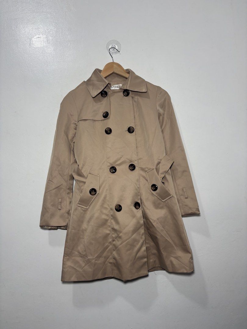 Beige Trench Coat Women Small (Category: Coats, Jackets and Outerwear) located in Balanga. Submitted by winterlab_ph (Listing ID 1459617194, Image 1). Description: Code: A812 Width: 16.5 Length: 31 Shoulders: 14 Sleeves: 22 : missing belts both sleeves.