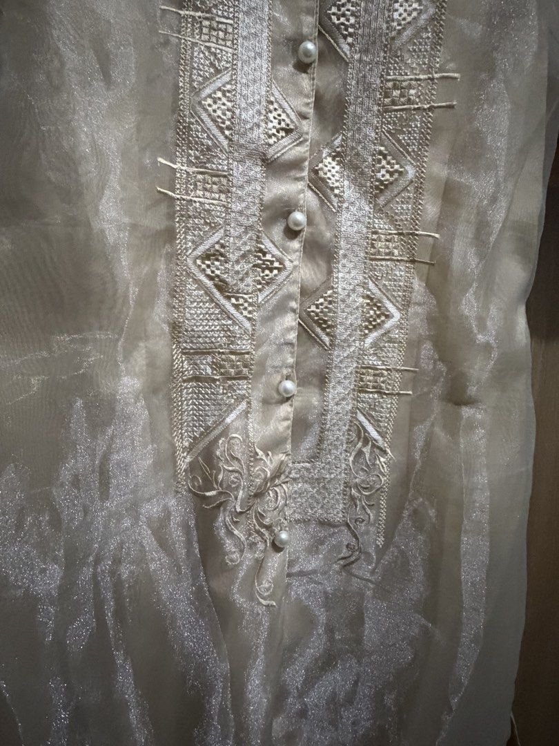 Beige/Cream-colored Filipiniana (Category: Traditional & Ethnic wear) located in Quezon City. Submitted by jianmorata89759 (Listing ID 1459620045, Image 3). Description: - Short puff sleeves - Intricate embroidery on the front - Pearl button closure - Light beige collar - Estimated size: Large but was resized to fit medium - small size - Ideal for formal events and cultural celebrations - Length: ~ 38 in - Waist : ~36 in RFS: Bought for graduatio
