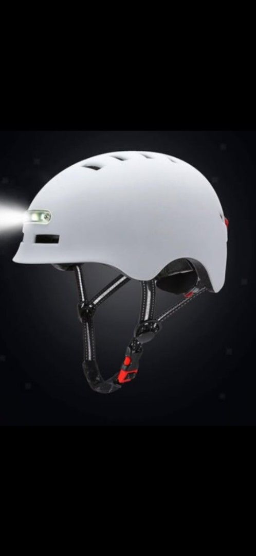 Bicycle Helmet with LED Lights (Category: Bicycles) located in San Mateo. Submitted by landerscollection (Listing ID 1459545165, Image 3). Description: - White helmet with integrated front and rear LED lights for enhanced visibility. - Adjustable straps ensure a secure and comfortable fit for various head sizes. - Vented design promotes airflow to keep you cool during rides..