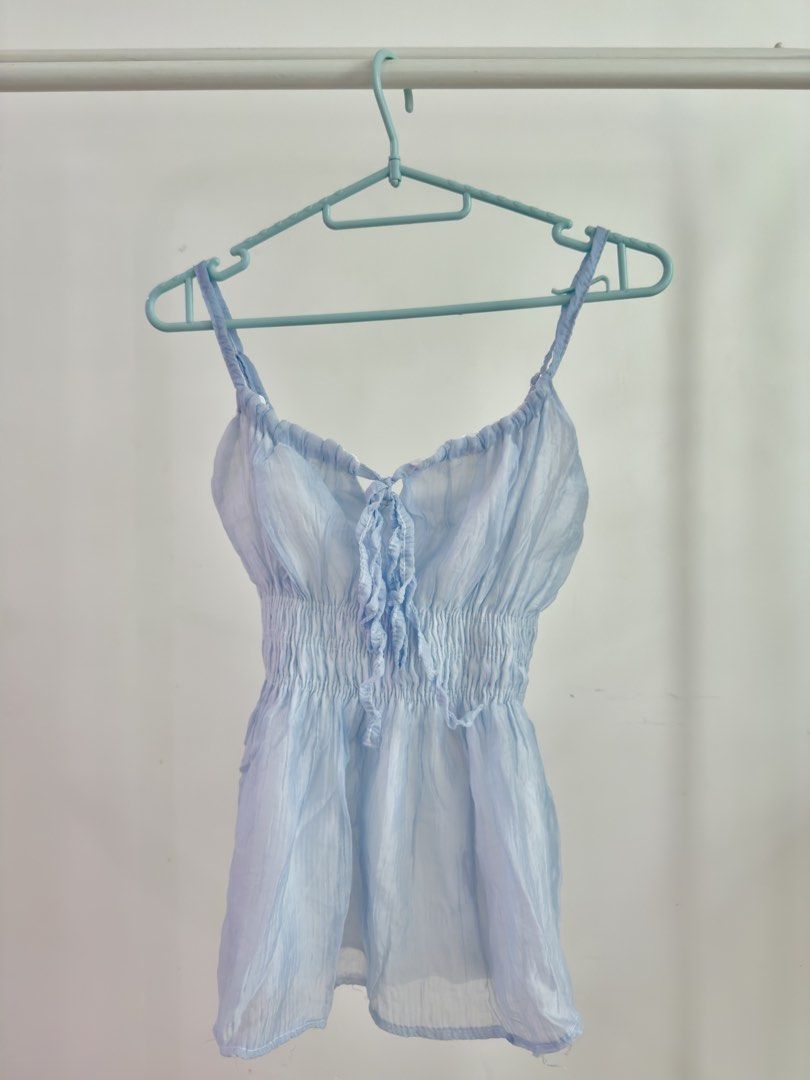 BKK Powder Blue Cute Tie Strap Sleeveless (Category: Sleeveless) located in Pasig City. Submitted by _prelovedbyace (Listing ID 1440919735, Image 1). Description: Free size | Used only once | BKK | With inner lining.