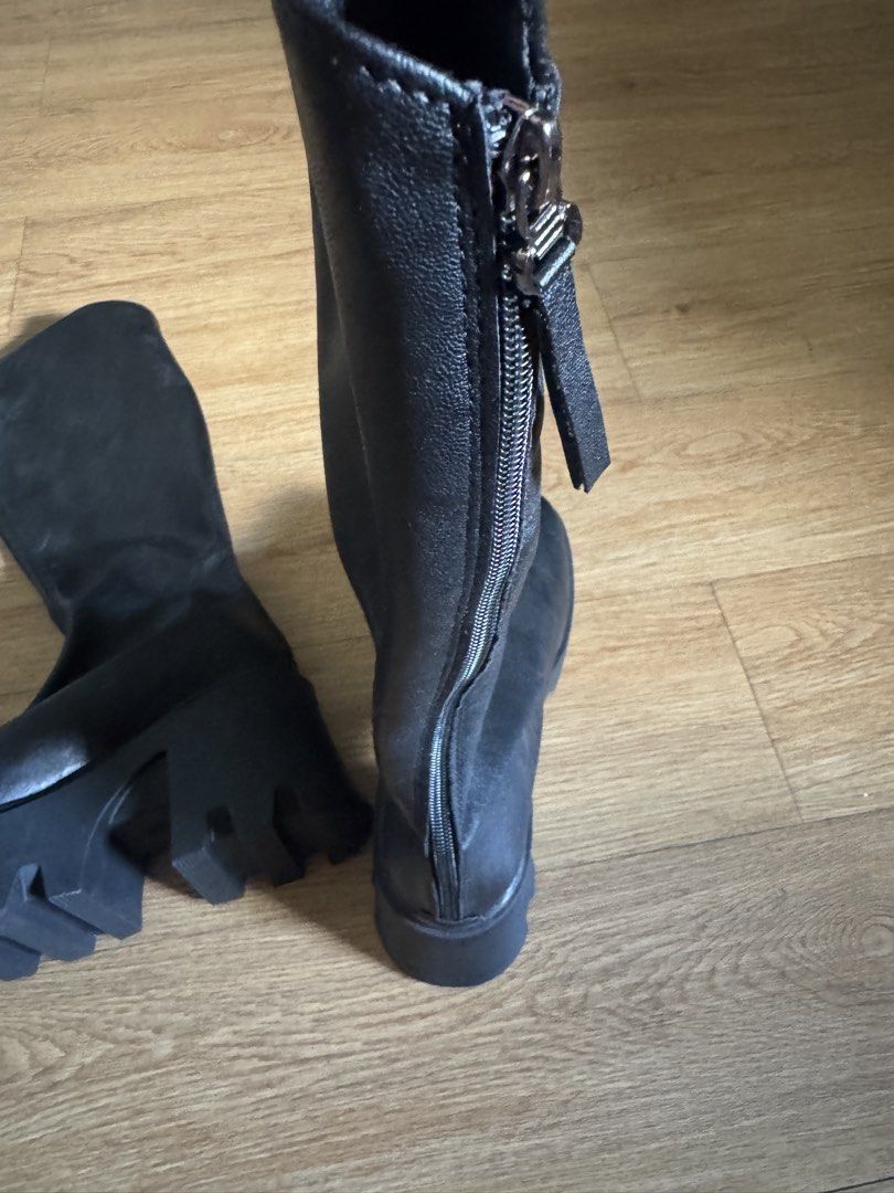 Black Chunky Platform Knee-High Boots (Category: Boots) located in Pasay City. Submitted by michmonteros (Listing ID 1459513694, Image 3). Description: - Black knee-high boots - Size 36 - Chunky platform sole with rugged tread - Side zipper closure for easy wear - Cool, edgy vibe - Versatile for styling with dresses or jeans.
