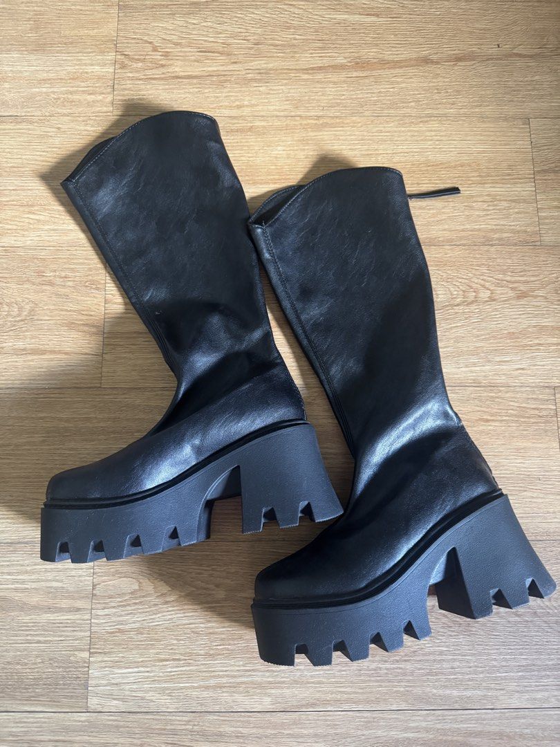 Black Chunky Platform Knee-High Boots (Category: Boots) located in Pasay City. Submitted by michmonteros (Listing ID 1459513694, Image 1). Description: - Black knee-high boots - Size 36 - Chunky platform sole with rugged tread - Side zipper closure for easy wear - Cool, edgy vibe - Versatile for styling with dresses or jeans.