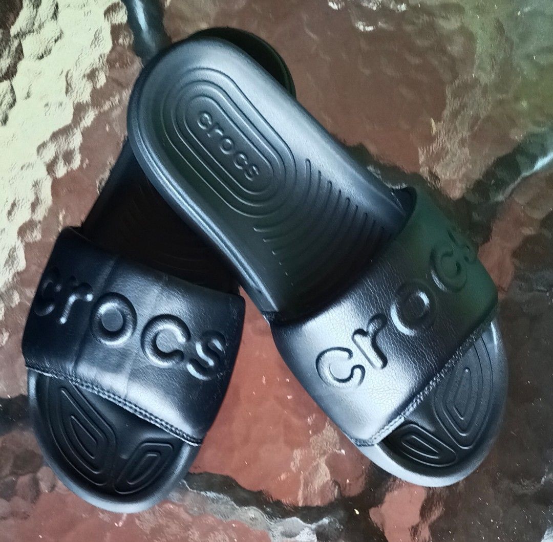 Black Crocs Slides Sandals (Category: Slippers and slides) located in Pavia. Submitted by taurusgirl74 (Listing ID 1459539644, Image 1). Description: - Classic black Crocs slides - Easy slip-on design - Contoured footbed for comfort - Grippy outsole for traction - Ideal for casual wear or after sports.