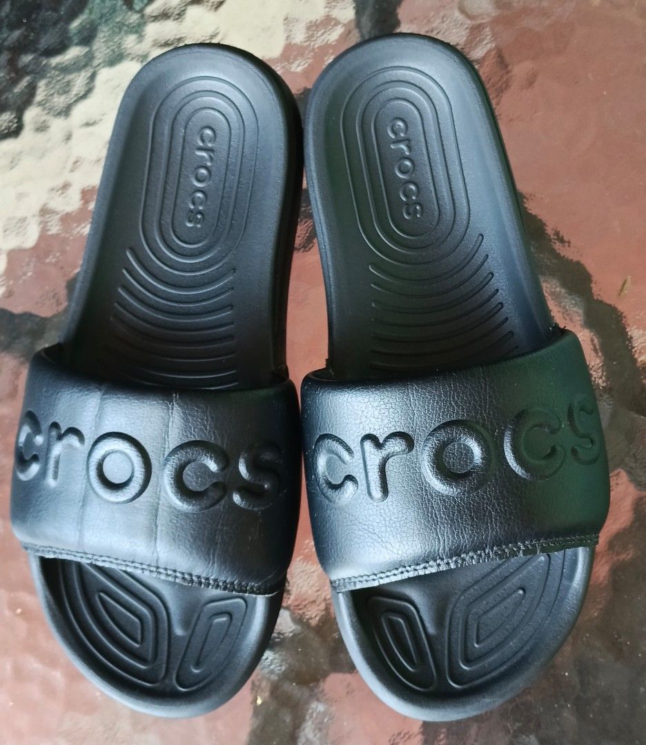 Black Crocs Slides Sandals (Category: Slippers and slides) located in Pavia. Submitted by taurusgirl74 (Listing ID 1459539644, Image 2). Description: - Classic black Crocs slides - Easy slip-on design - Contoured footbed for comfort - Grippy outsole for traction - Ideal for casual wear or after sports.