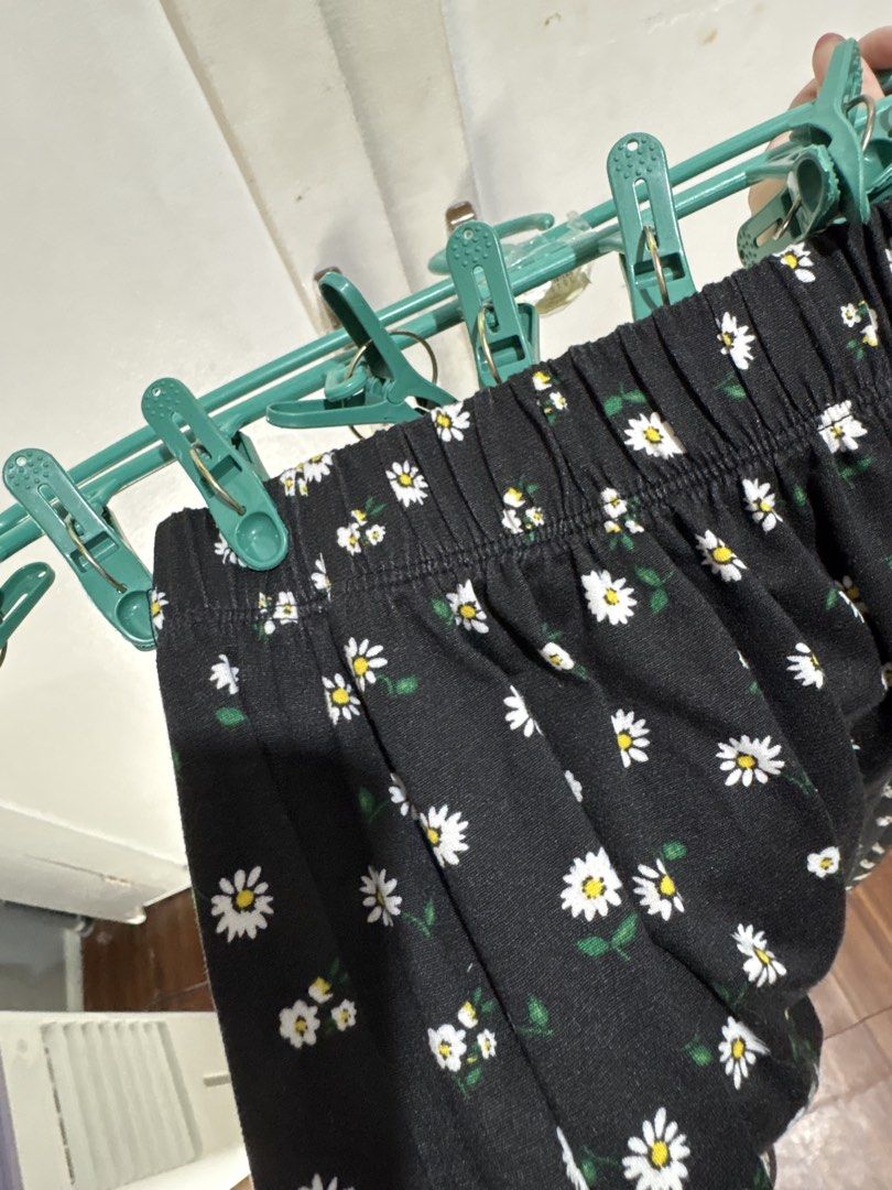 Black Daisy Print Maxi Skirt with Slit (Category: Skirts) located in Malabon City. Submitted by julia4a_ (Listing ID 1459603297, Image 3). Description: - Black maxi skirt - Cute all-over daisy print - Side slit for easy movement - Comfortable elastic waistband - Versatile for casual or dressed-up occasions - Pairs well with simple tops.