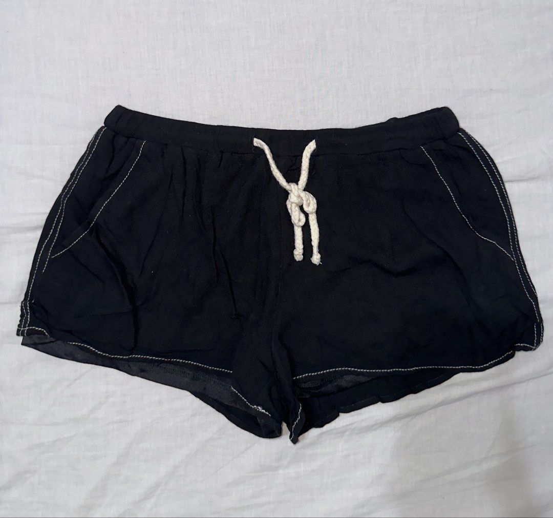 Black Drawstring Shorts with White Stitching (Category: Shorts) located in Santa Ana. Submitted by fatikilla (Listing ID 1459541426, Image 1). Description: - Comfy black shorts - Elastic waistband with drawstring - White contrast stitching along the sides - Relaxed fit - Ideal for lounging or casual wear.
