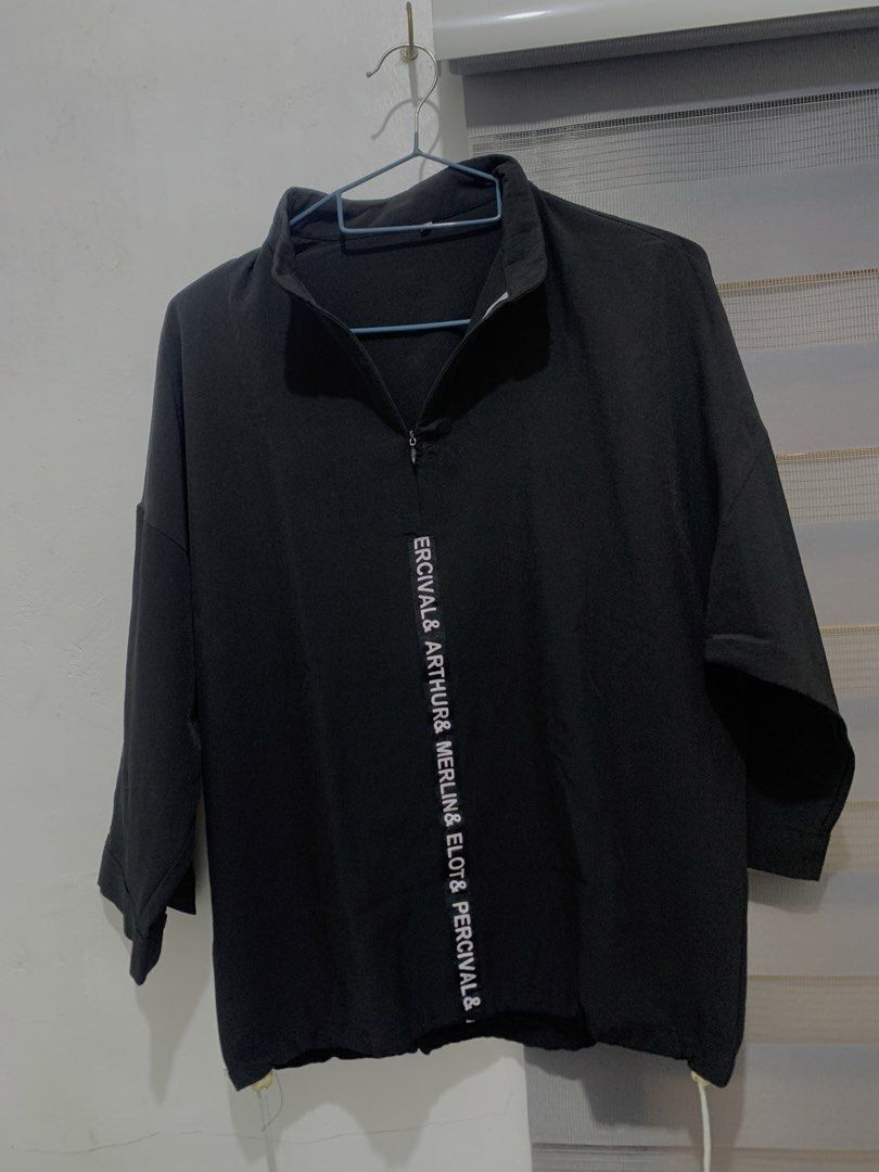 Black Half-Zip Pullover (Category: Blouses) located in Caloocan City. Submitted by jjasss.mn_ (Listing ID 1459531775, Image 2). Description: Features vertical white lettering running down the front placket. Soft and cold fabric Can fit up to Medium .