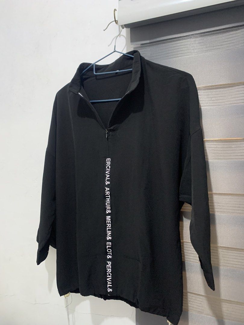 Black Half-Zip Pullover (Category: Blouses) located in Caloocan City. Submitted by jjasss.mn_ (Listing ID 1459531775, Image 3). Description: Features vertical white lettering running down the front placket. Soft and cold fabric Can fit up to Medium .